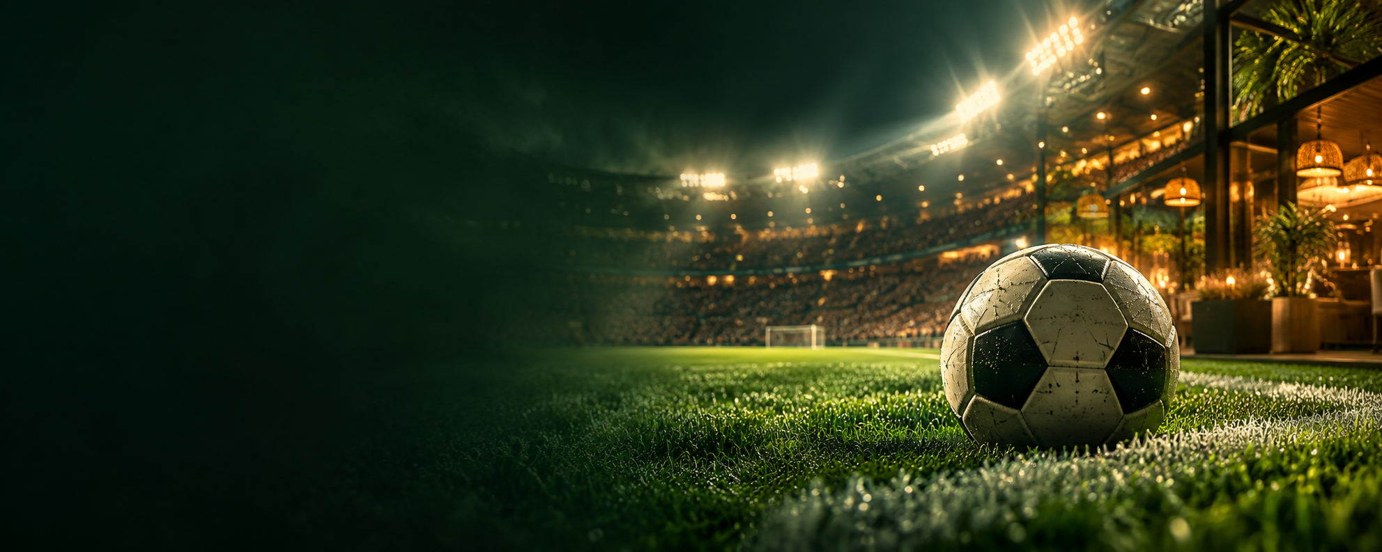 Balón de fútbol iluminado en un estadio